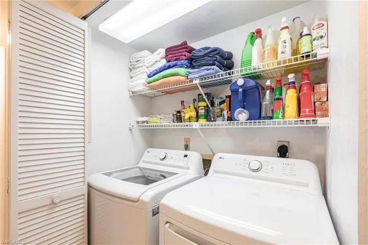 Laundry room featuring washing machine and clothes dryer