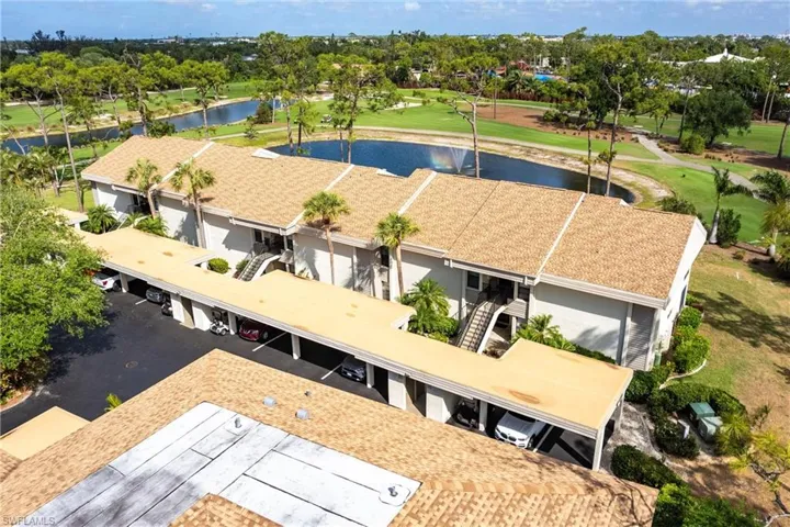 Drone / aerial view of a large body of water and a golf course