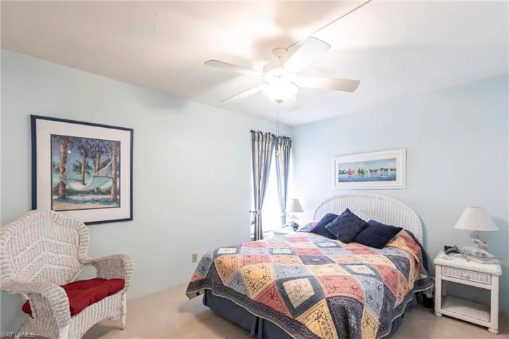 Second Bedroom with carpet and a ceiling fan