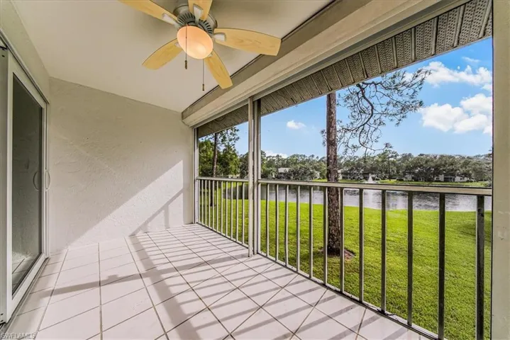 Unfurnished sunroom with a water view