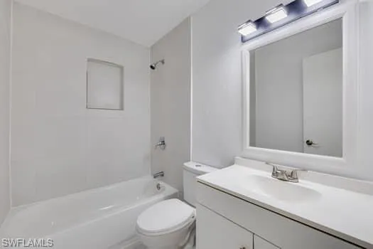Bathroom with shower / tub combination and vanity