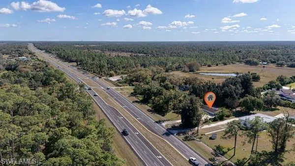 Drone / aerial view of a forest and a main thoroughfare