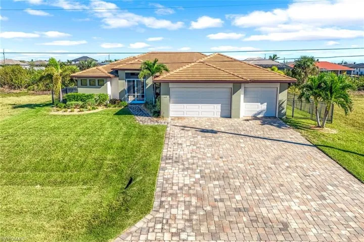 3 car Garage, Tile Roof  and Paver Driveway