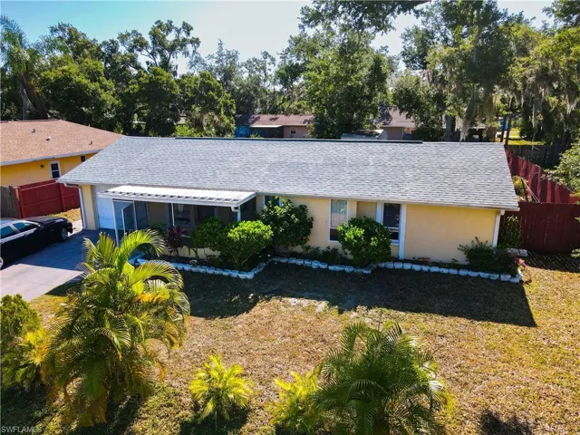 Ranch-style home with a front lawn