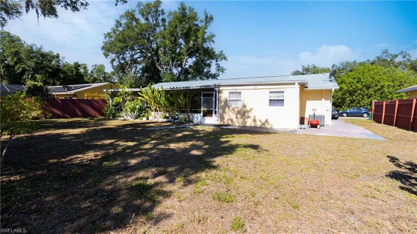 Back of house featuring a patio area and a yard
