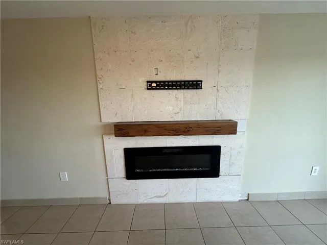 Room details featuring tile patterned flooring and a fireplace