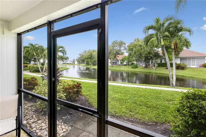 Unfurnished sunroom with a water view