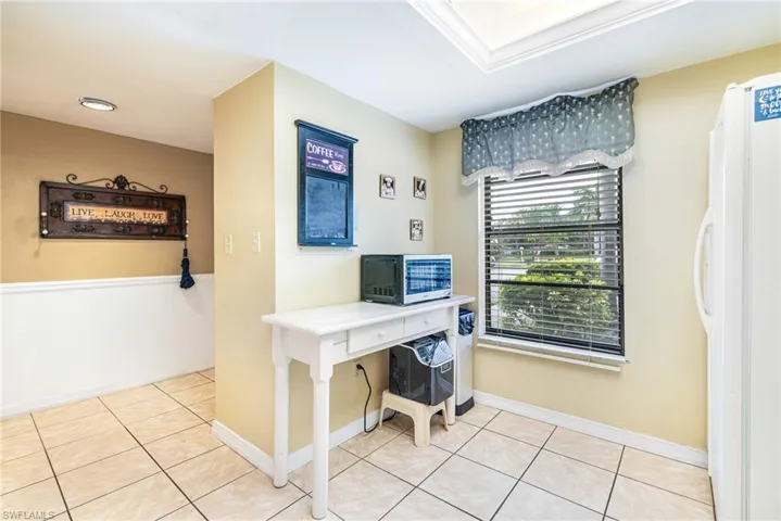 Office area with light tile patterned flooring