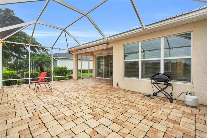 View of patio with a lanai