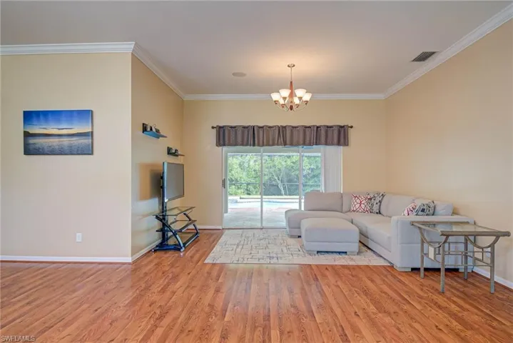 Walk in the front door to the open formal living and dining area and view of the pool!
