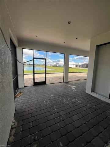 Extended covered lanai with water views - updated 12/27/2023