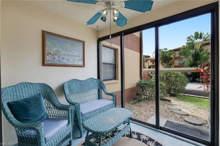 Sunroom / solarium featuring ceiling fan