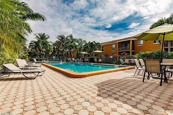 Community pool featuring a patio area