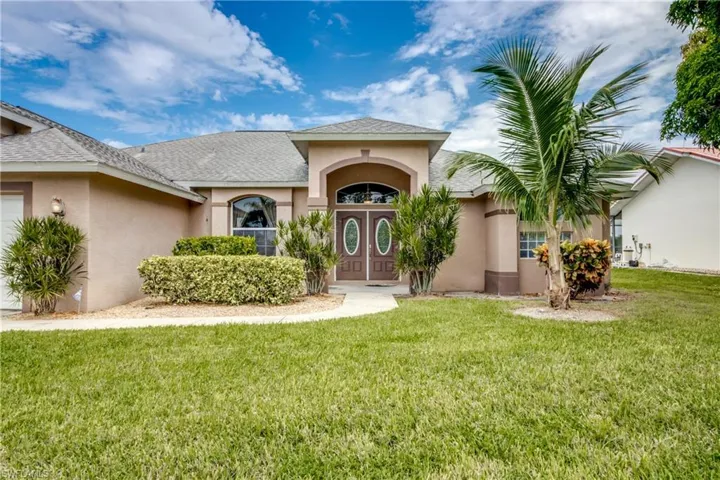 View of front of property with a front yard