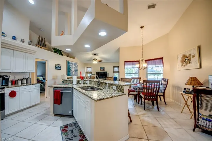Kitchen and breakfast nook area with double windows. Plenty of room for casual dining.