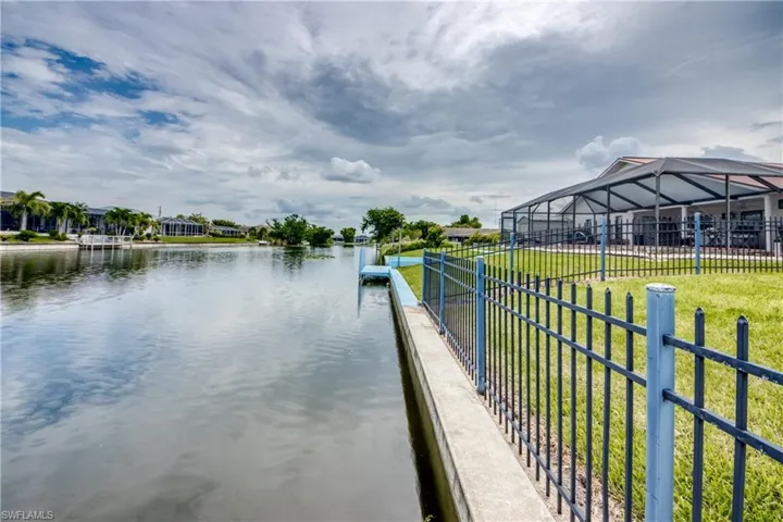 View of dock looking down the canal view from back/side yard