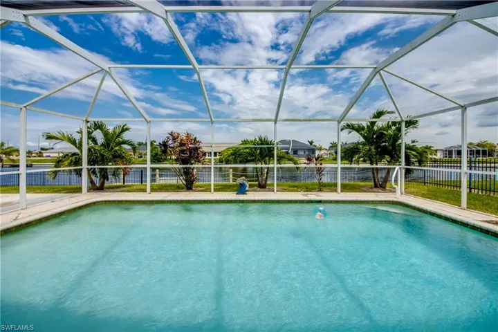View of pool with a canal water view. So peaceful.
