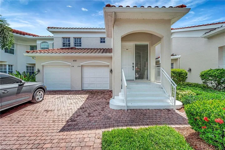 Front entry and one car attached garage with driveway