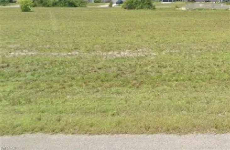 View of green lawn featuring a rural view