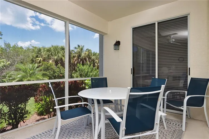 Sunroom featuring outdoor dining area