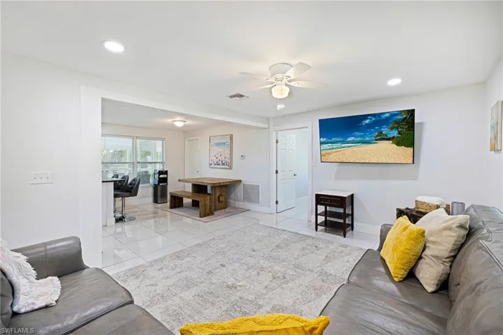 Living room featuring recessed lighting and ceiling fan
