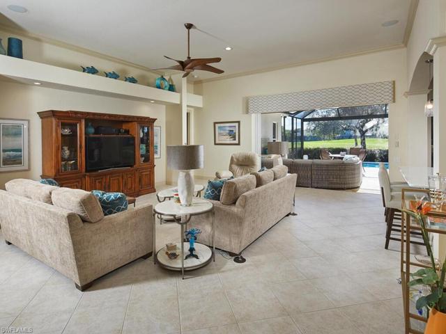 Great Room with view toward lanai. Sliding glass doors pocket, giving an unobstructed view. Neutral decorating color palette throughout.  Ceramic tile floor, installed on the diagonal.