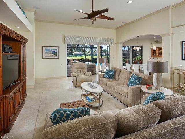 Great room with renovations opening the view into kitchen. Wall behind entertainment center on left is flat without niches, allowing a large size TV to be mounted.