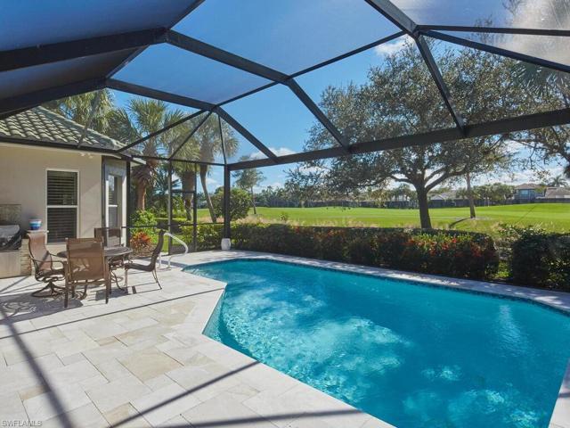 Beautiful view of enticing pool and golf fairway in the distance.