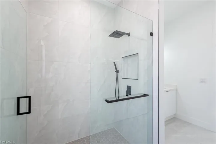 Bathroom with a stall shower and vanity