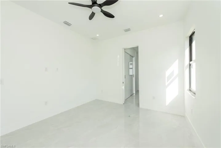 Spare room featuring a ceiling fan and recessed lighting