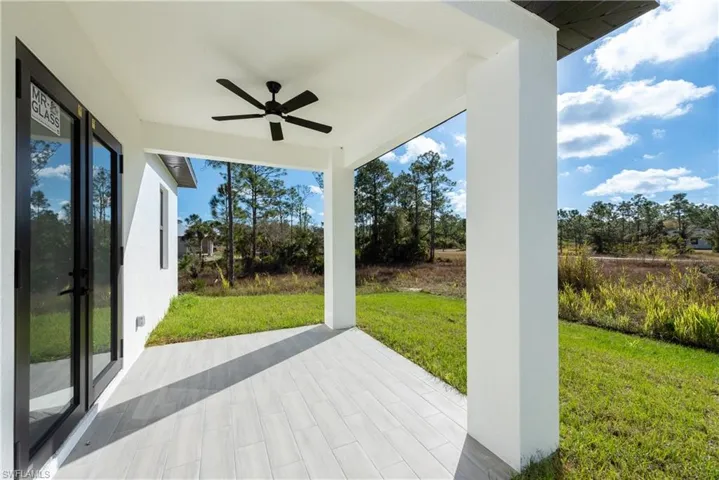 View of patio with a ceiling fan