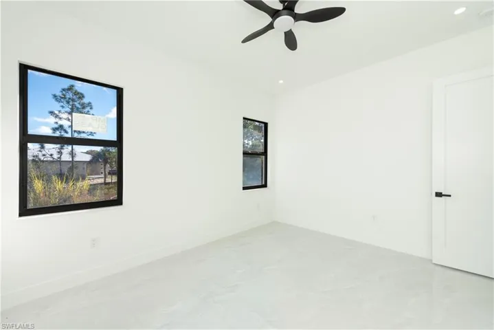 Unfurnished room featuring ceiling fan and recessed lighting