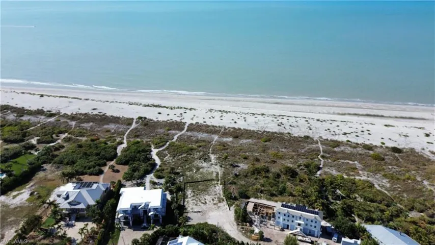 Bird's eye view of waterfront with a beach