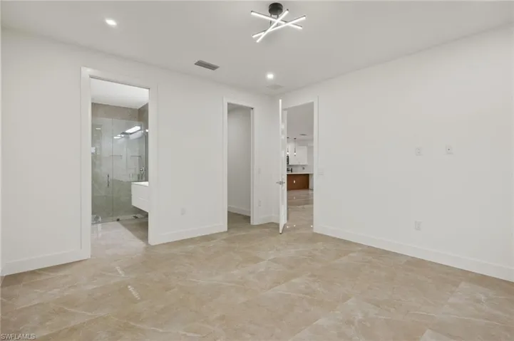 Unfurnished bedroom with ensuite bathroom