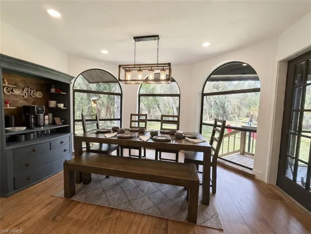 Dining area featuring light wood-style floors and recessed lighting