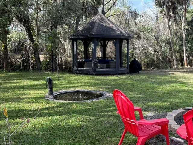 View of green lawn with a gazebo
