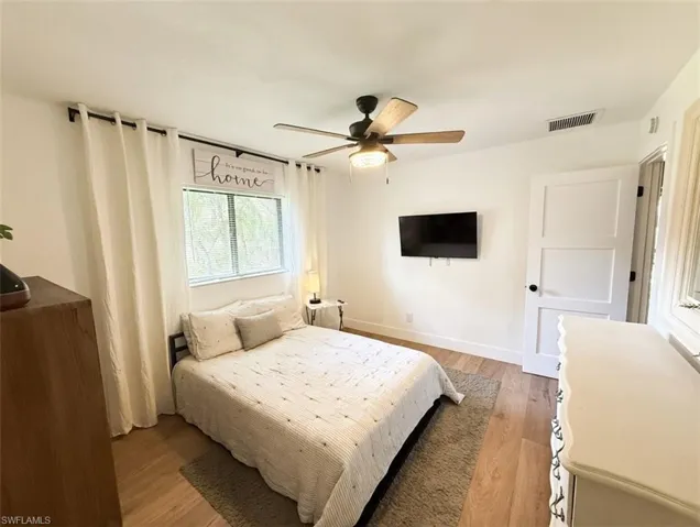 Bedroom with light wood-type flooring and ceiling fan