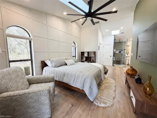 Bedroom with wood finished floors and a ceiling fan