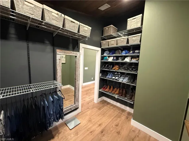 Walk in closet featuring light wood-style floors