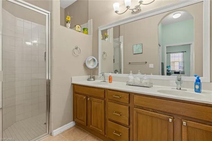 Primary Bathroom with dual vanity, walk-in shower