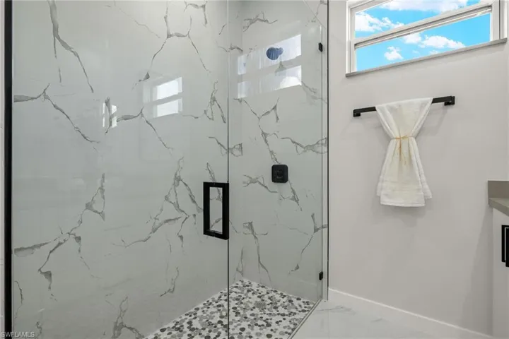 Bathroom featuring a shower with shower door