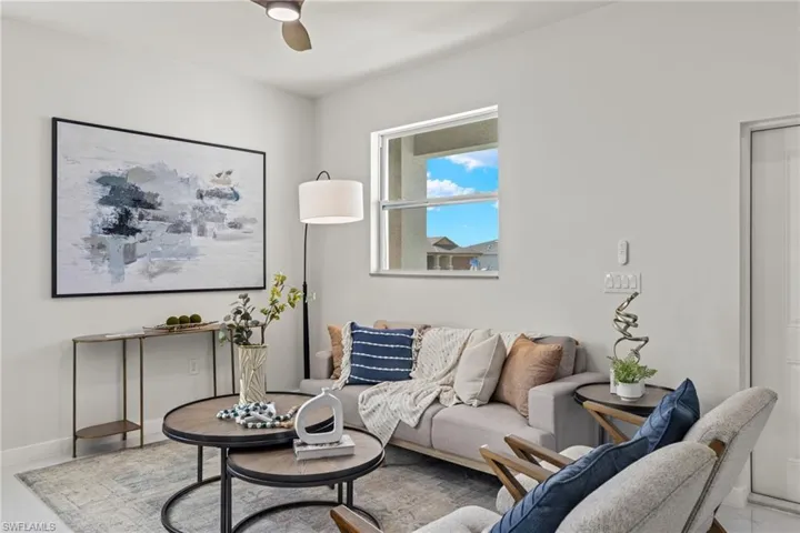 Living room featuring ceiling fan