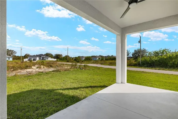 View of yard with a patio and ceiling fan