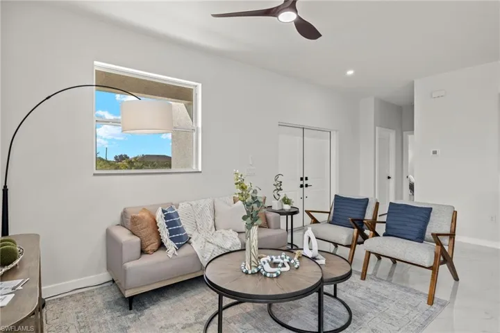 Living room featuring ceiling fan