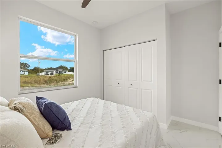 Bedroom featuring a closet and ceiling fan