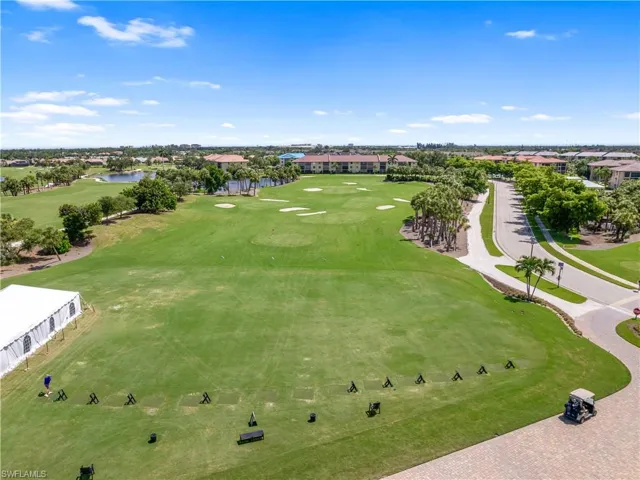 Bird's eye view featuring a water view and view of golf course