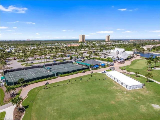 Aerial view with a water view and view of golf course