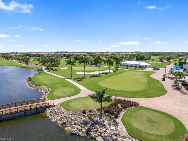 View of community with view of golf course and a water view