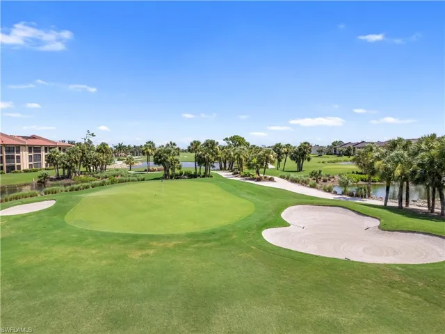 View of home's community with view of golf course and a water view
