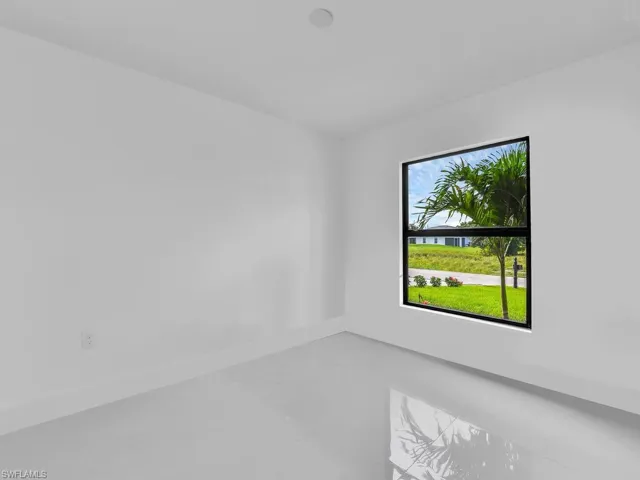 Unfurnished room with a healthy amount of sunlight